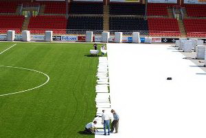 Temporary floor for grassed stadium